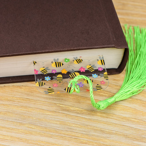 a book with a bookmark and a green tassel
