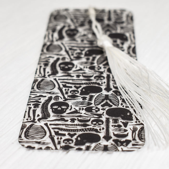 a black and white book with a tassel on top of it