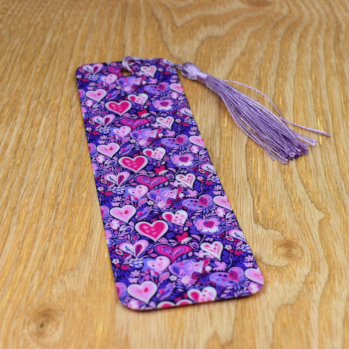 a purple tie with hearts on it sitting on a table