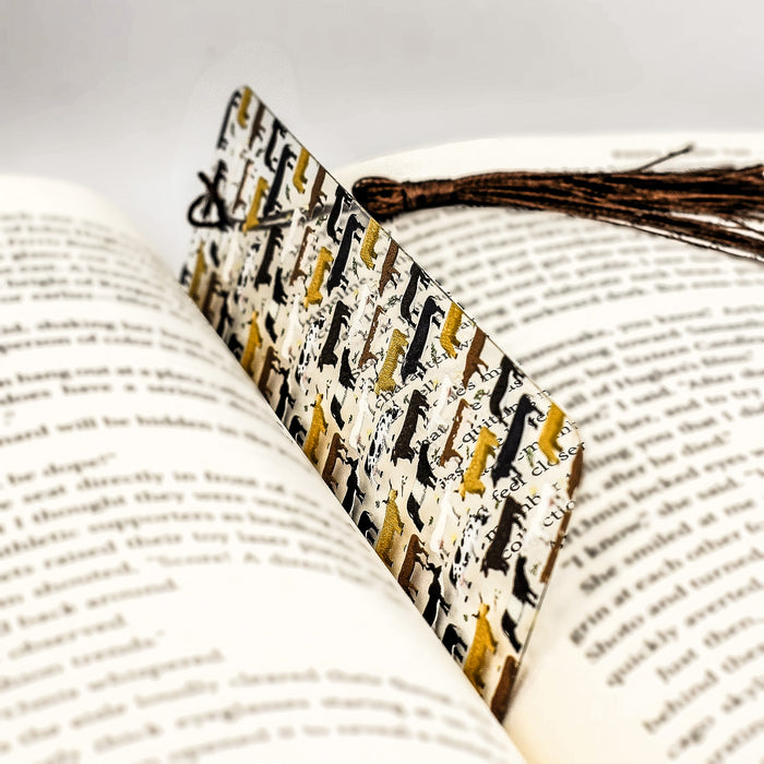 an open book with a bookmark on top of it