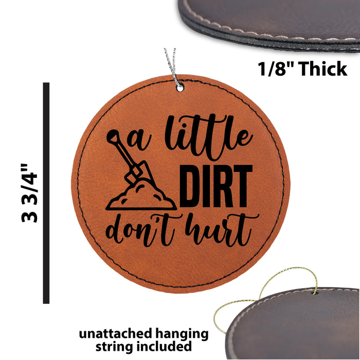 a leather ornament with the words, a little dirt don't hurt