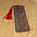 a black and red tie sitting on top of a wooden table