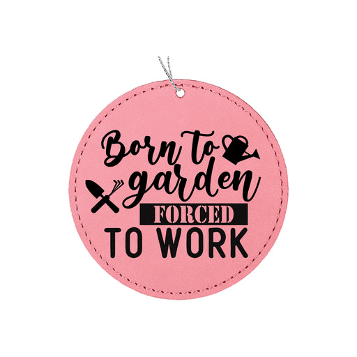 a pink round ornament that says born to garden forced to work