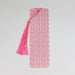 a pink and white bookmark with a tassel