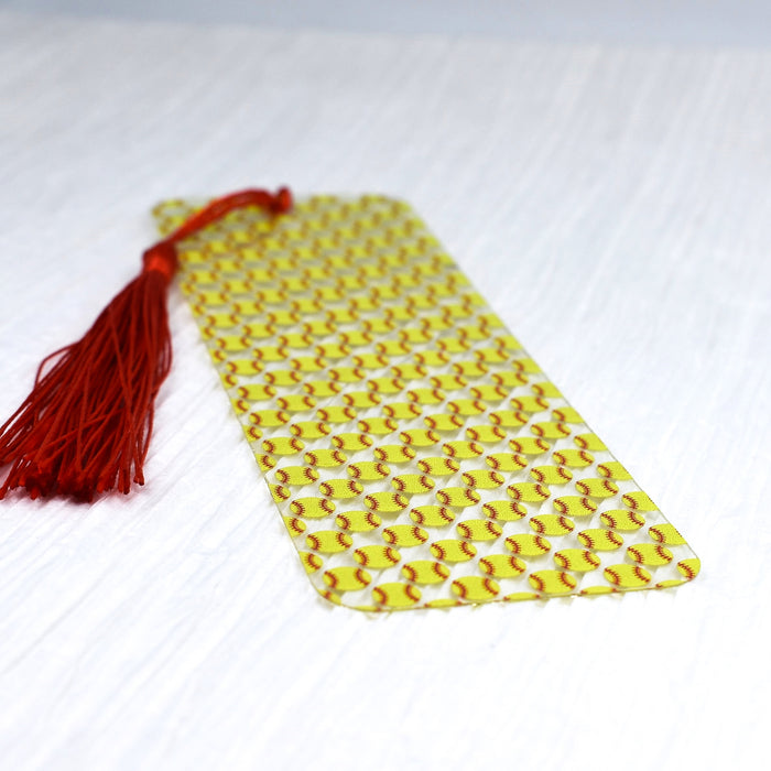 a yellow tie with a red tassel on it