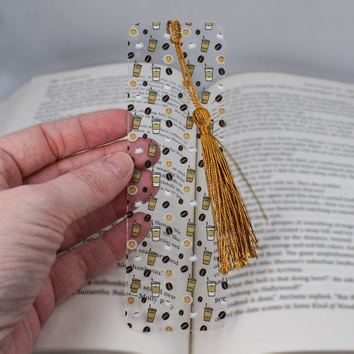 a person holding a bookmark in their hand