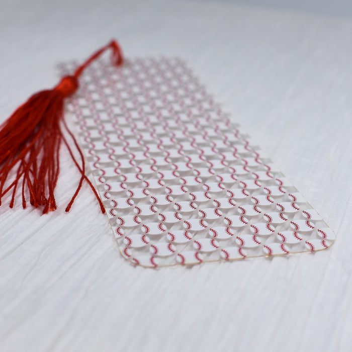 a piece of fabric with a tassel on top of it