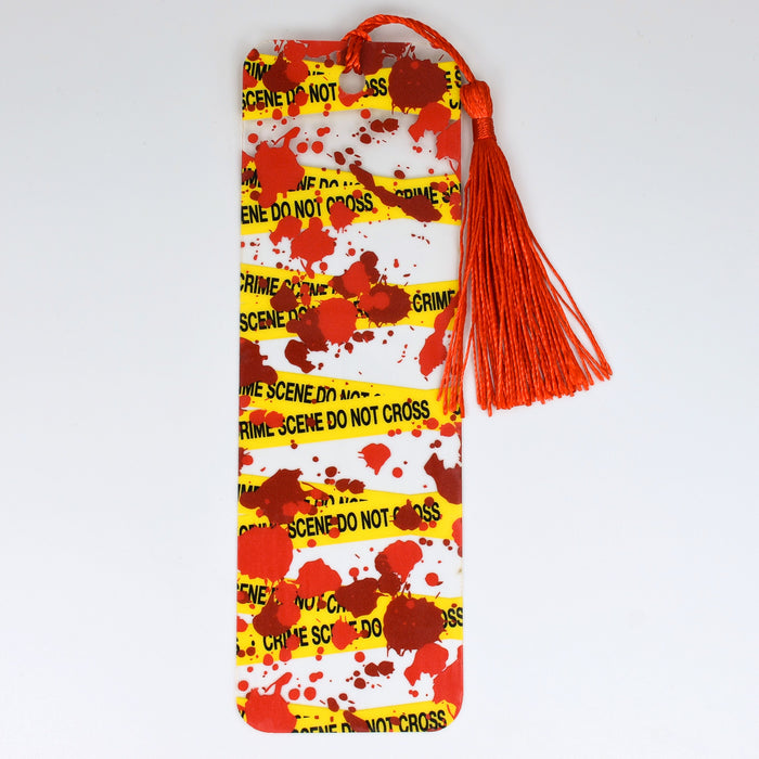 a red and yellow bookmark with a tassel on it