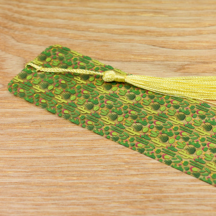 a green and yellow tie on a wooden table