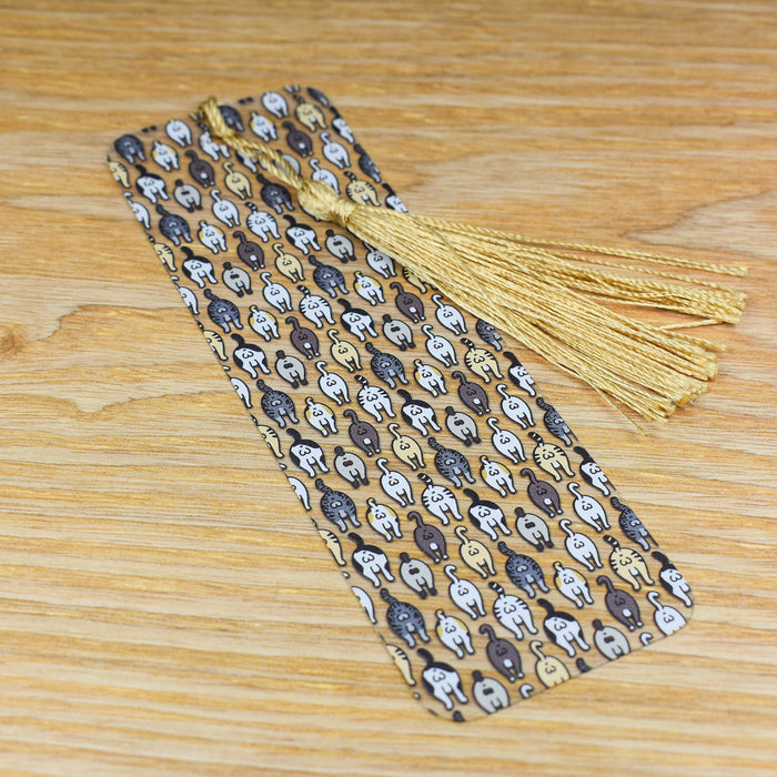 a tie with skulls and a tassel on a wooden table