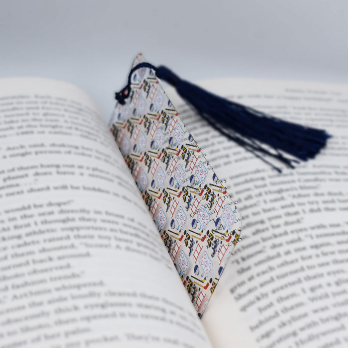 a book with a tassel on top of it