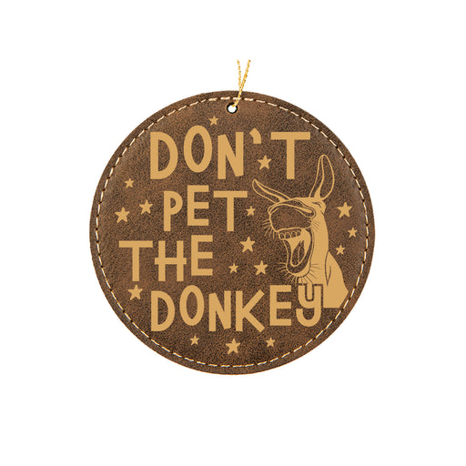 a brown leather ornament with a picture of a dog and the words don