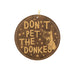 a brown leather ornament with a picture of a dog and the words don