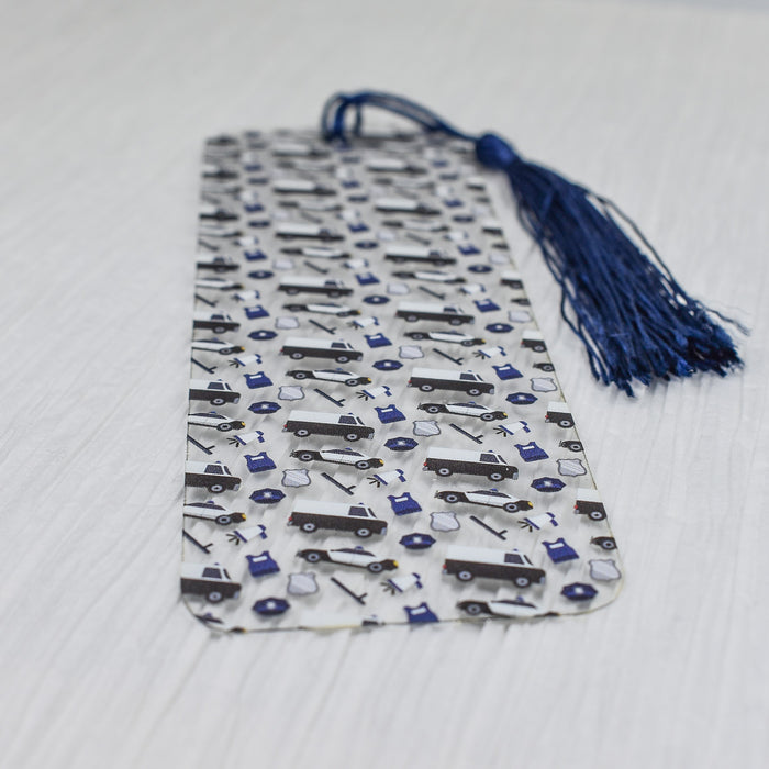 a tie with a blue tassel on top of it
