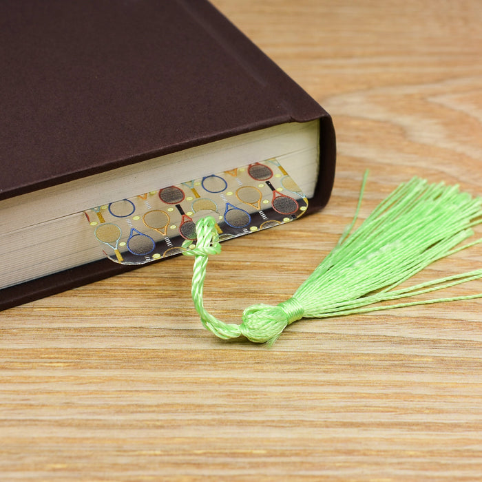 a book with a tassel on top of it