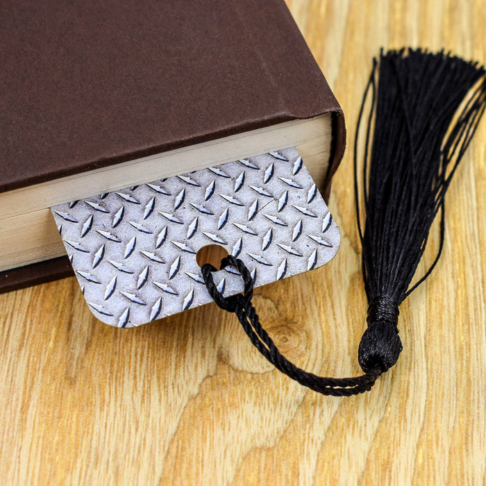 a book with a tassel on top of it