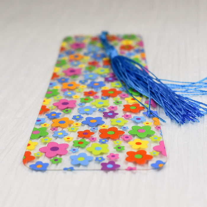 a bookmark with a tassel on a table