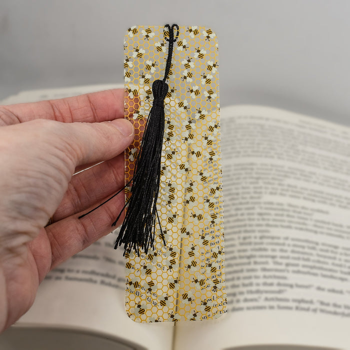 a person holding a bookmark in their hand