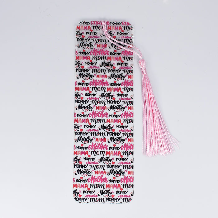 a pink and black bookmark with a pink tassel