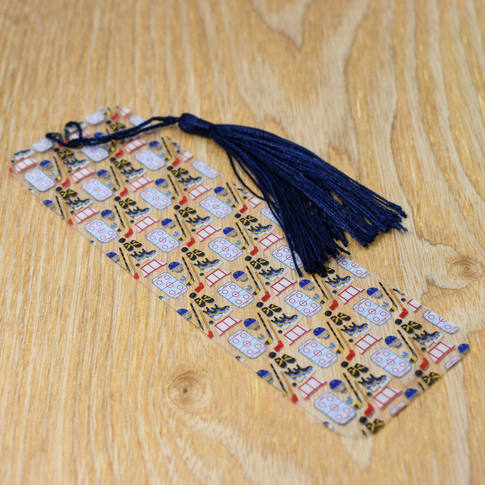 a tie with a tassel on a wooden table