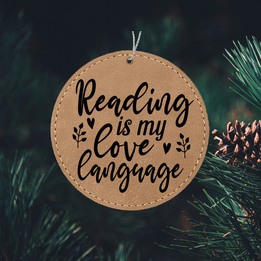 a wooden ornament that reads reading is my love language