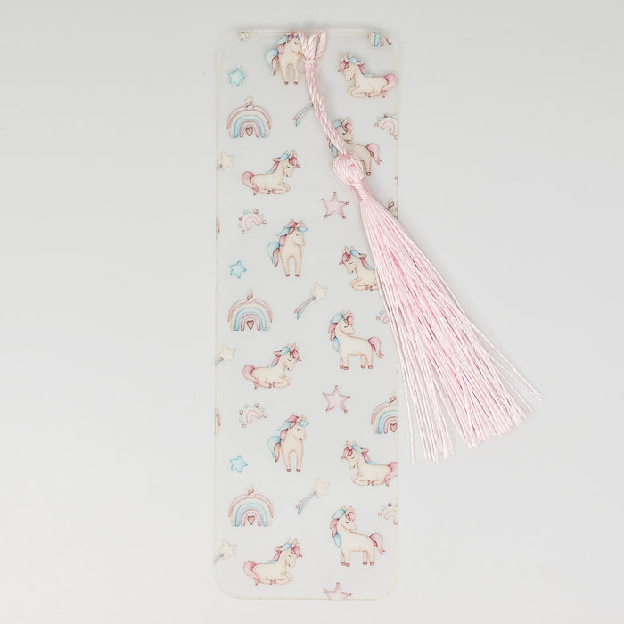a bookmark with unicorns and stars on it