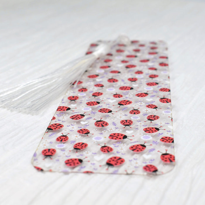 a red and black tie with ladybugs on it