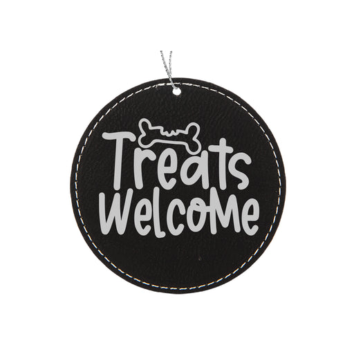 a black and white sign that says treats welcome