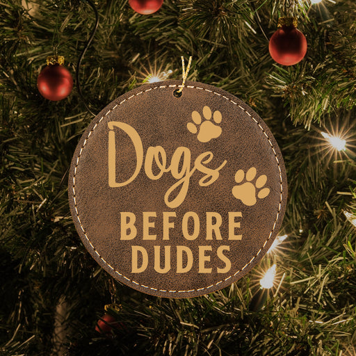 a dog's before dudes ornament hanging from a christmas tree
