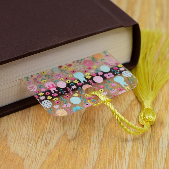 a book with a tassel on top of it