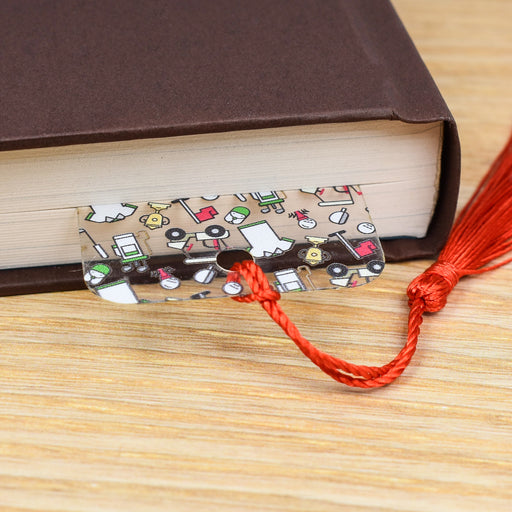 a book with a red tassel on top of it