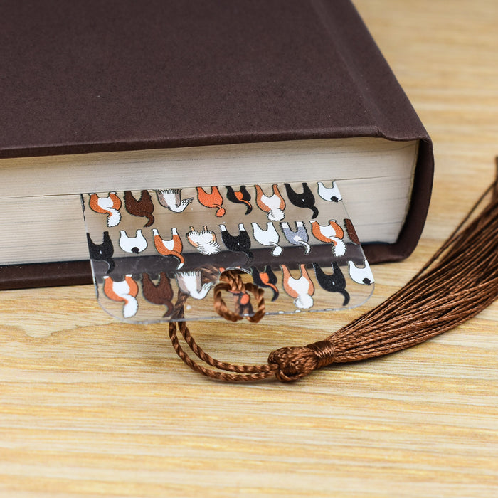 a book with cats on it and a tassel