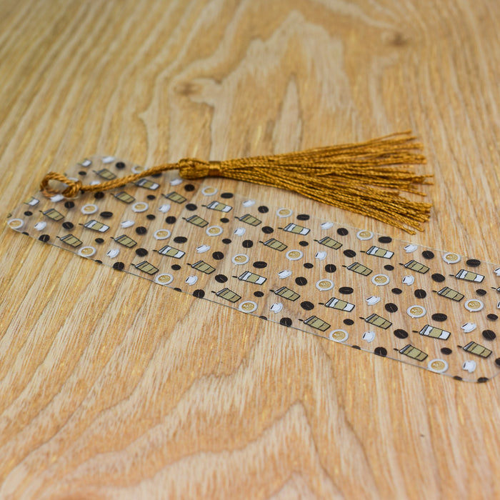 a tasseled piece of fabric sitting on top of a wooden table