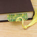 a book with a tassel on top of it