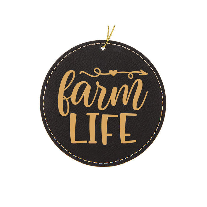 a black and gold leather ornament with the words farm life on it