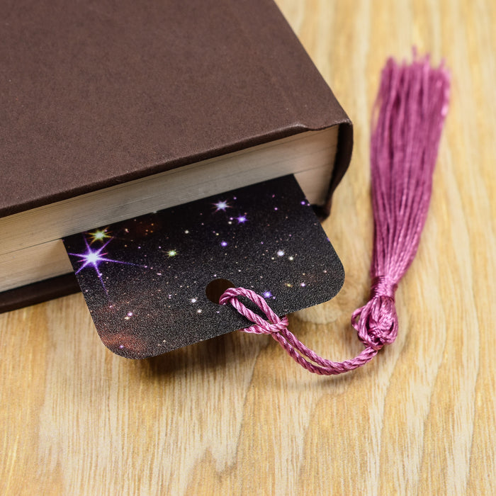 a book with a tassel on top of it