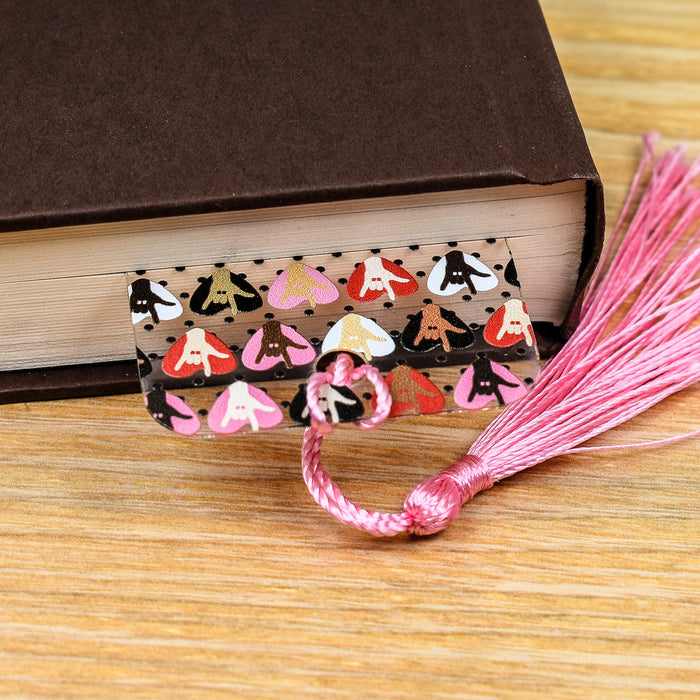 a book with a tassel on top of it