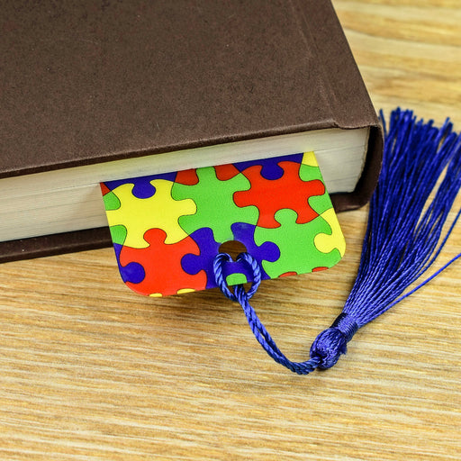 a book with a bookmark made out of puzzle pieces