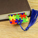 a book with a bookmark made out of puzzle pieces