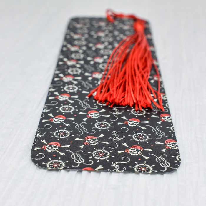 a bookmark with a red tassel on top of it