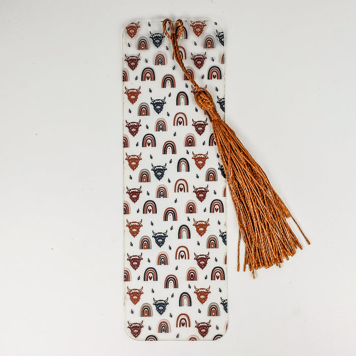 a bookmark with a tassel on it
