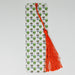 a bookmark with an orange tassel hanging from it