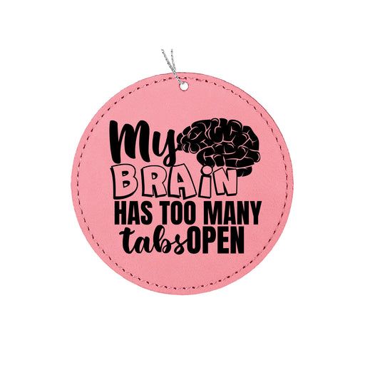 a pink round ornament that says, my brain has too many tables open