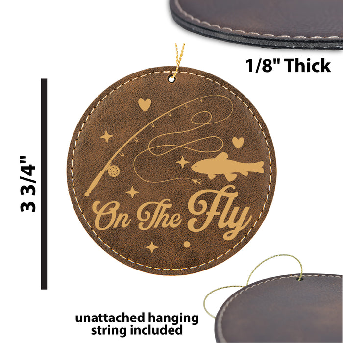 a leather ornament with the words on the fly