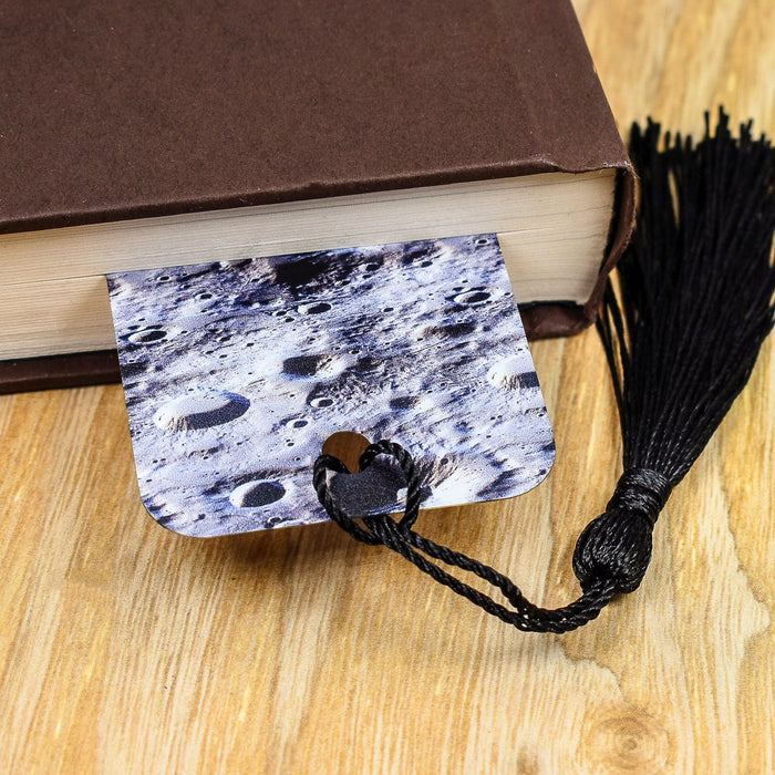 a book with a tassel on top of it