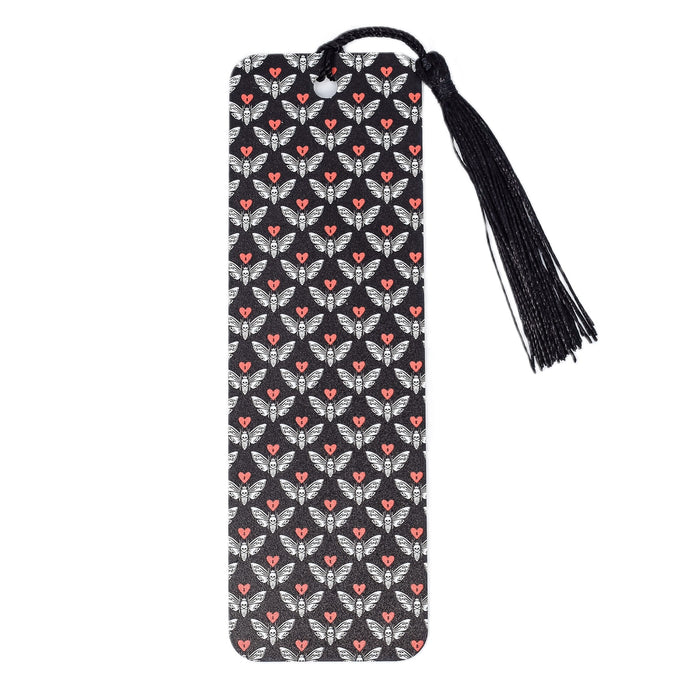 a black and white bookmark with a red heart on it