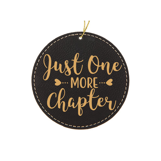 a black leather ornament with gold lettering that says just one more charter