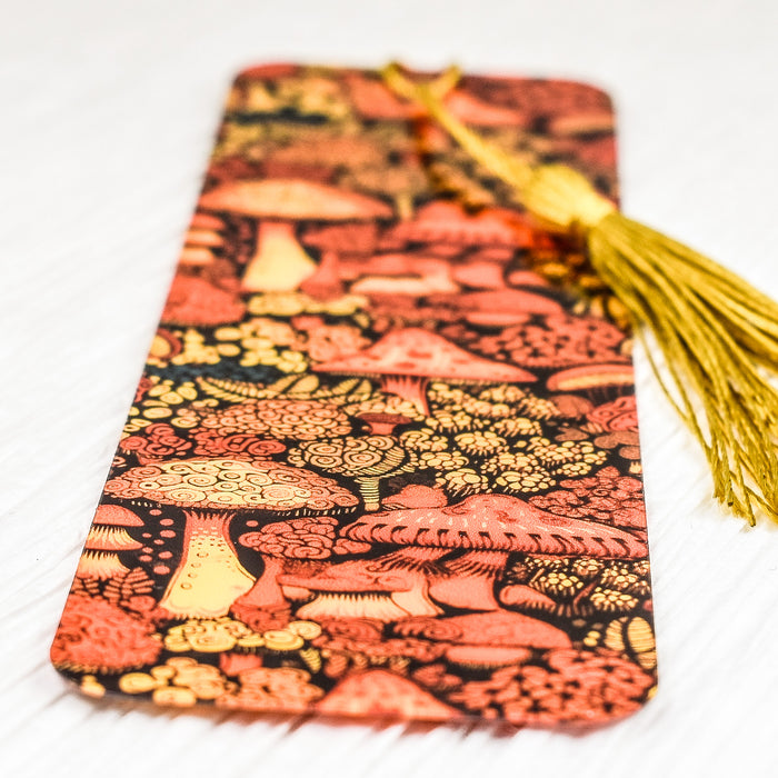 a bookmark with a yellow tassel on top of it