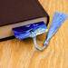 a book with a tassel on top of it