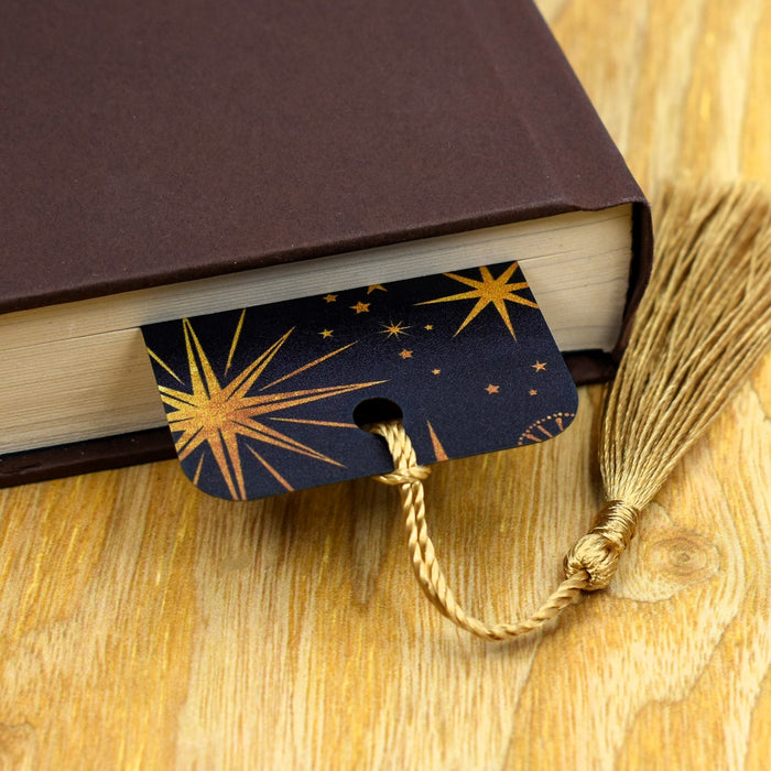 a book with a tassel on top of it